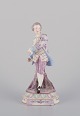Antique German porcelain figurine. Large figurine of a young man in fine clothes. Hand-painted ...