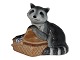 Small Royal 
Copenhagen 
figurine, 
racoon with 
food box.
Decoration 
number 055.
Factory ...