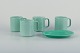 Royal Copenhagen, "4 All Seasons", four coffee mugs and a small oval dish in faience with green ...