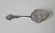 Serving spade 
in silver 
richly 
decorated with 
flowers and 
ship 
Stamp: 835 
Length 21.5 
cm.