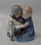 Royal 
Copenhagen 
figurine "707 
RC Children 
with dog Chr. 
Thomsen 1905 15 
cm  in mint 
condition