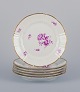Bing & 
Grøndahl. Set 
of six luncheon 
plates with 
flower 
decorations in 
purple and gold 
trim. ...
