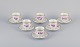 Bing & 
Grøndahl, 
Denmark. A set 
of six coffee 
cups and 
saucers with 
flower 
decorations in 
purple ...