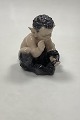 Royal 
Copenhagen 
Figurine Faun 
with Snake No 
1712 by 
Christian 
Thomsen. 
Measures 11 cm 
/ 4 21/64 in.