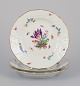 Meissen, 
Germany. Three 
plates in 
porcelain, 
hand-painted 
with different 
polychrome 
flowers and ...