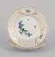 Meissen, 
Germany. Two 
open lace 
plates in 
porcelain, 
decorated in 
gold with an 
exotic bird on 
a ...