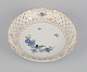 Meissen, 
Germany. Open 
lace bowl in 
porcelain, 
decorated in 
gold with an 
exotic bird on 
a flower ...