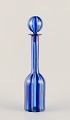 Murano, Italy. 
Art glass 
decanter with a 
striped design.
Blue tones 
with gold 
stripes.
From ...