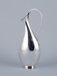 Hugo Grün, 
Danish 
silversmith. 
Modernist 
pitcher in 
sterling silver 
in an organic 
and sleek ...