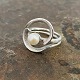 Sculptural ring of sterling silver with cultured pearlØ 22 mm. Inner dimensions 18