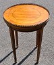 French rosewood lamp table, 20th century. Brass edge and bronze decorations. Height: 58 cm. ...