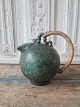 Arne Bang jug 
with bast 
handle. The jug 
has an 
incredibly 
beautiful green 
glaze. 
Signed AB - 
...