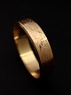 14 carat gold bangle inside 6 x 5.5 cm. W. 1.5 cm. weight 25.7 grams from jeweler Herman ...