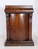 Entrance furniture in mahogany with a door decorated with carvings from around the ...