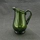 Height 10.5 cm.The creamer is mouth blown and with an attached handle. It has a so-called ...