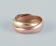 Cartier "Trinity" ring in 18 karat gold, white gold, and rose gold.Approximately from the ...