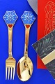 A. Michelsen 
Christmas 
cutlery,  
gilded sterling 
silver with an 
inlaid  enamel 
motif. 
Christmas ...