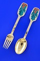 Anton Michelsen 
Christmas 
cutlery, gilded 
sterlingsilver 
with an inlaid 
enamel motif.  
Christmas ...
