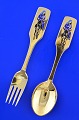 Anton Michelsen 
Christmas 
cutlery, gilded 
sterling silver 
with an inlaid  
enamel motif. 
...