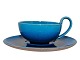 Kähler art pottery, blue tea cup with high handle and matching saucer.The cop measures 9.8 ...