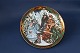 This beautiful Christmas plate has a beautiful motif of the family picking up the Christmas ...