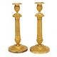 Pair of fire 
gilt Empire 
bronze 
candlesticks. 
France ...