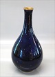 B&G Cobalt blue 
Vase 24,5 cm. 
Decorated with 
gold pattern 
and gold rim cm 
Marked B&G Made 
in ...