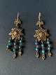 These beautiful 
earrings in 
silver with 
inlaid 
turquoise are 
beautifully 
made with many 
details. ...