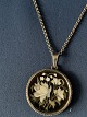 Beautiful silver chain with pendant. The pendant has an inlaid floral motif. The pendant's ...