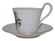 Bing & Grondahl high handle cup with saucer. The cup is decorated with flowers.The factory ...