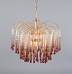 Murano, Italy. 
Large ceiling 
lamp in amber 
mouth-blown art 
glass, brass 
frame. Italian 
design. ...