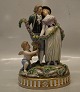 12154 RC 
Lovers: 
Vicotrian 
couple and 
puttis 24 x 17 
cm with chain 
of flowers 
Royal 
Copenhagen ...