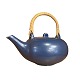 Eva Stæhr-Nielsen for Saxbo; A teapot decorated with a blue glaze. With handle in ...