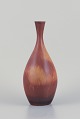 Carl Harry Stålhane (1920-1990) for Rörstrand, Sweden. Vase in hare's fur glaze. Darkred and ...