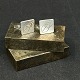 Length 2.5 cm.
Stamped 
Sterling JTH 
Denmark FDL.
A pair of 
cufflinks 
decorated with 
black ...
