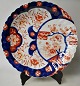 Japanese Imari porcelain dish, 19th century. Polychrome decorated. With ruffled edge. With blue ...