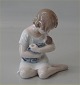 Royal 
Copenhagen 1938 
RC Girl with 
doll Ada 
Bonfils 13 cm 
In mint and 
nice condition