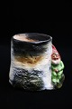 Antique painted 
terracotta 
gnome from 
around 1910 
which sits on a 
tree stump with 
space for a ...