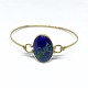 Bangle of 14 kt. gold set with a cabochon cut azurite.The bangle can be opened.Inner ...