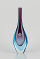 Murano, Italy. 
Art glass vase 
with a slender 
neck. Blue and 
purple glass.
Approximately 
...