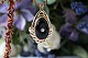 Beautiful 
pendant in 14 
carat gold, 
with brilliant 
and black onyx. 
On the front of 
the pendant ...