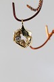 This small 
pendant in 14 
carat gold is 
something quite 
special. It is 
truly timeless 
and ...