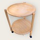 Tray table in 
light wood, 
with 
collapsible 
frame and two 
loose plates, 
one with a 
rotating lower 
...