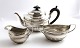 English tea set in sterling silver (925). Consisting of teapot, creamer and 
sugar bowl. Produced London 1885.