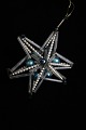 Old Christmas 
tree decoration 
in the shape of 
Christmas
star made of 
small glass 
balls and ...