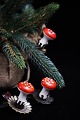 Old Christmas 
tree decoration 
in the form of 
a small red 
mushroom in 
cotton wool 
sitting on a 
...