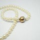 Per Borup; Clasp of 14k gold and white gold, with pearl necklace.L. 43 cm.Pearl Dia. 6 ...