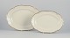 KPM, Poland. 
Two large oval 
porcelain 
serving 
platters.
Cream-colored 
with gold rim 
...