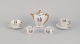 Limoges 
Porcelaine, 
France.
Coffee pot, 
teacup, and a 
coffee cup with 
saucers, as 
well as two ...