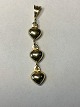 Nice and simple 
pendant for a 
necklace, with 
three gold 
hearts in 14 
carat gold. The 
pendant is ...